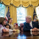 President Donald Trump meets with children of journalists, dressed for Halloween, and White House staffers in the Oval Office at the White House on Oct. 27, 2017. (Drew Angerer/Getty Images)